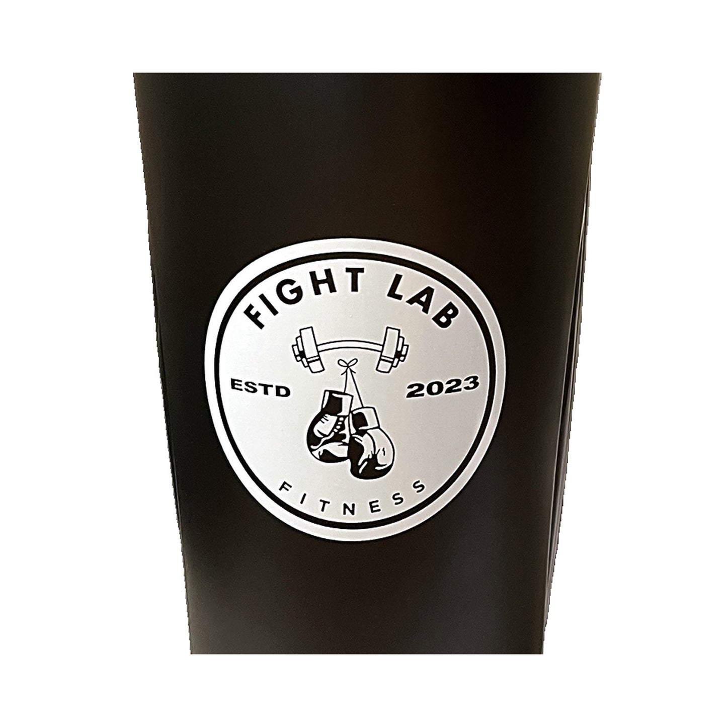 Close-up of the Fight Lab Fitness boxing glove logo badge on the shaker cup