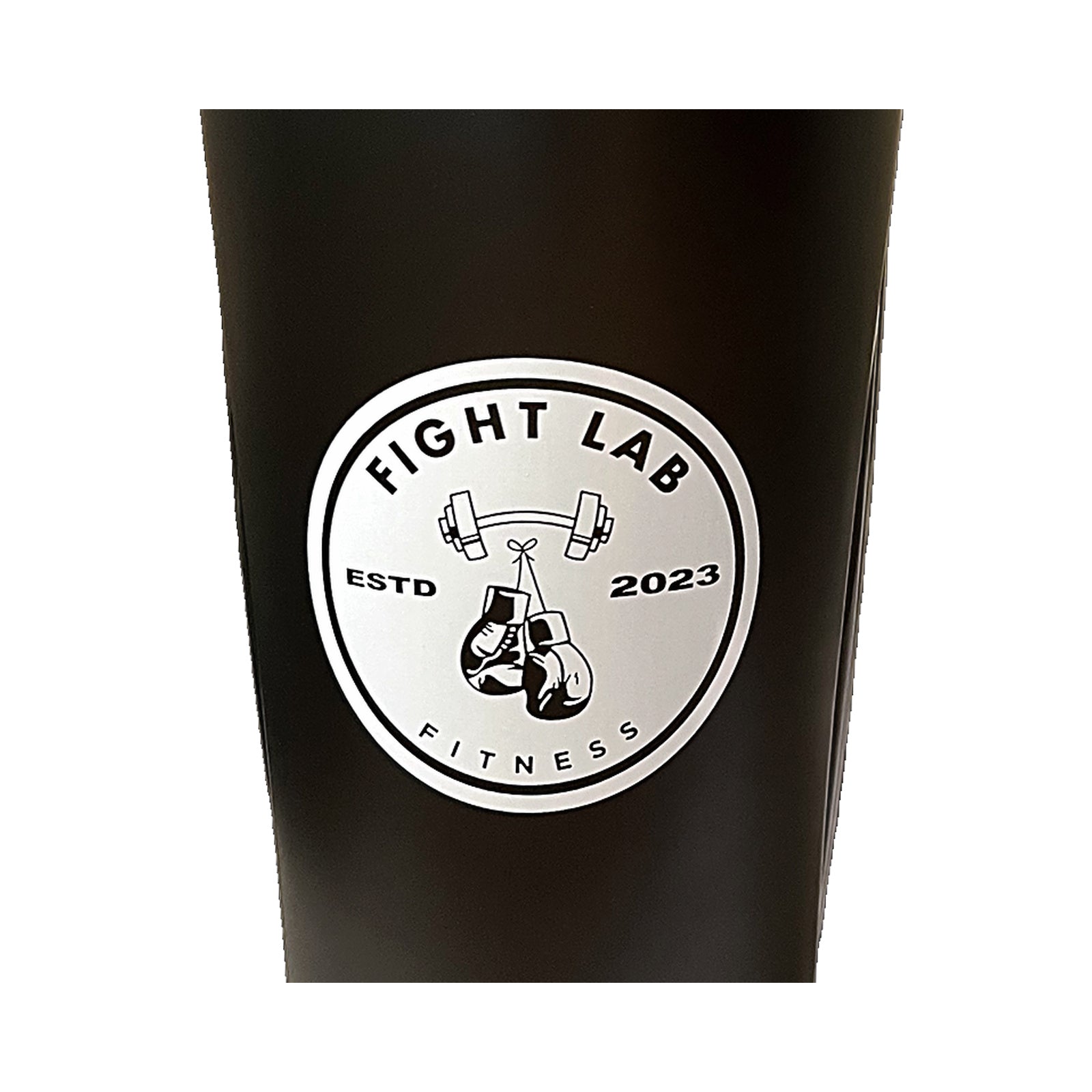 Close-up of the Fight Lab Fitness boxing glove logo badge on the shaker cup
